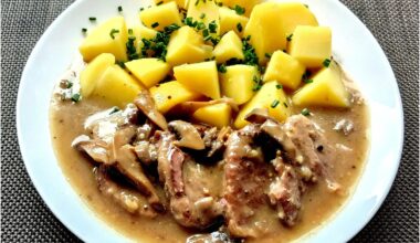 Pork leg on mushrooms in the style of roast beef, boiled potato.