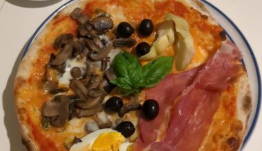 The good old pizza capricciosa: Prosciutto di Parma, Artichoke, Eggs, Mushrooms, Mozzarella, Cherry tomatoes sauce.