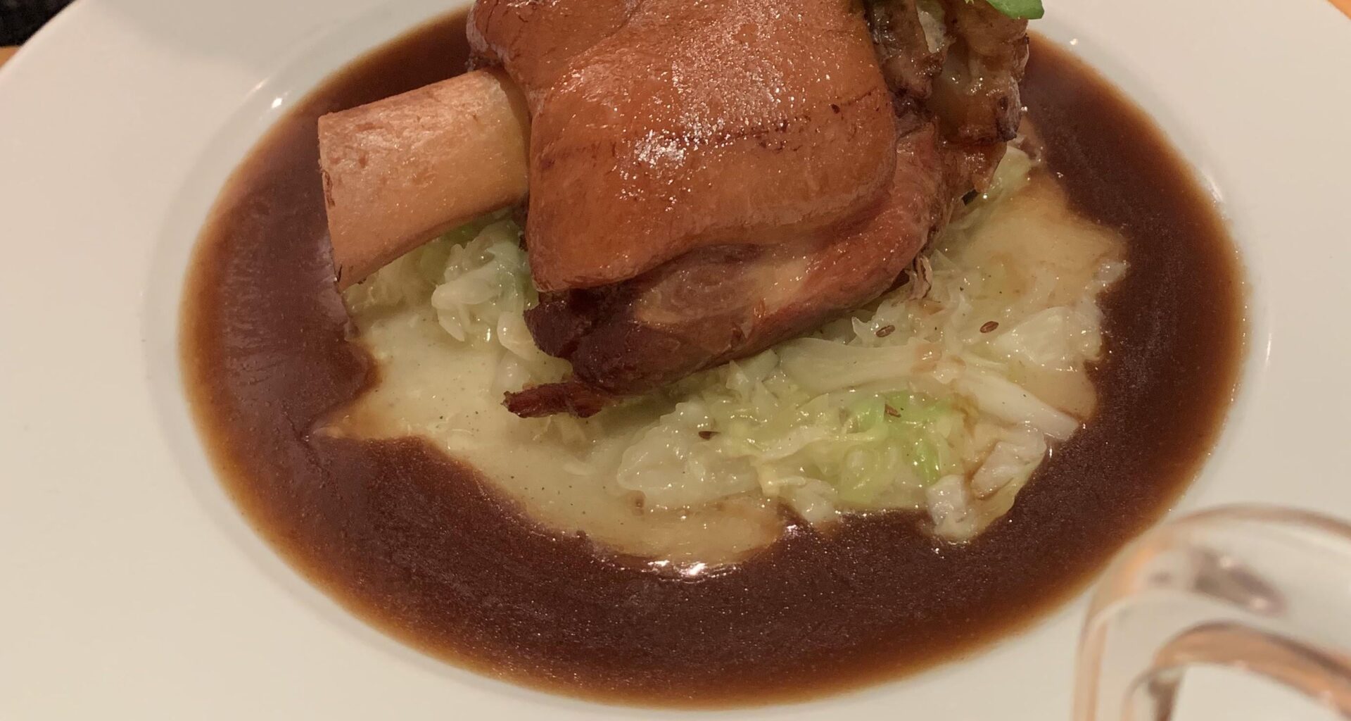 roast pork with mashed potato, buttered cabbage & gravy