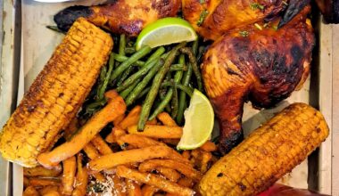 My attempt at a homemade Nandos. Piri-piri chicken with garlic and parmesan chips, greenbeans and corn
