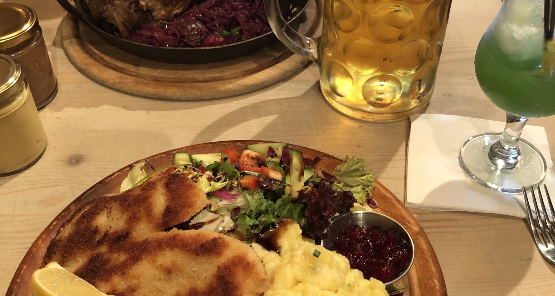 Pork schnitzel, potato salad and greens
