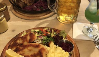 Pork schnitzel, potato salad and greens