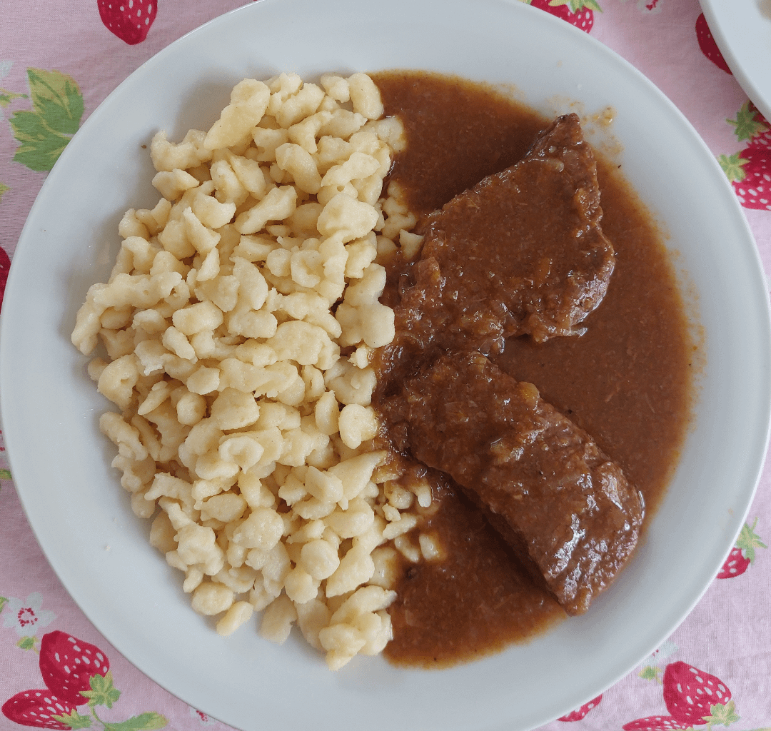 Even better reheated! Beef cutlets in red wine sauce with Nockerl (egg noodles).