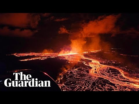 Aerial shots show lava and smoke erupting from volcano in Iceland