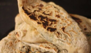 Zhingyalov hats (flatbread stuffed with finely diced herbs and green vegetables. It is a traditional dish of Armenians from Artsakh and Syunik and has traditionally been a staple in times of scarcity, such as famine and war).