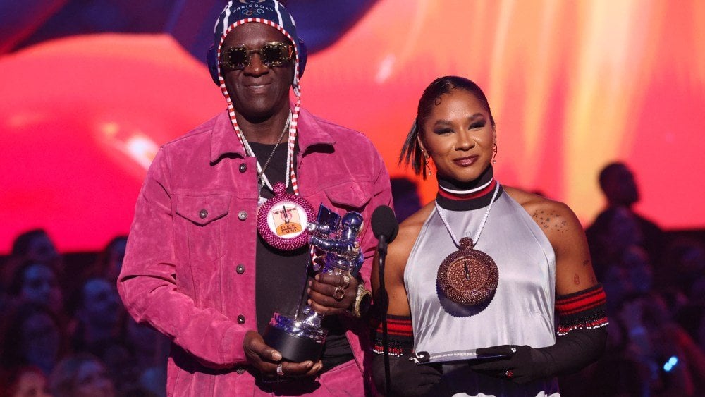 Flavor Flav Gives Jordan Chiles Her Own Bronze Clock Chain at MTV VMAs After Medal Was Taken From Her