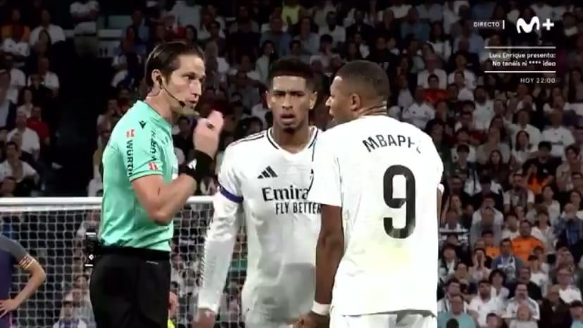 Mbappé’s argument with the ref: the ref thinks the gesture is a sign of disrespect, Mbappé protests that he didn’t even say anything. The ref later ends the conversation by doing the same gesture that got Mbappé a yellow card initially