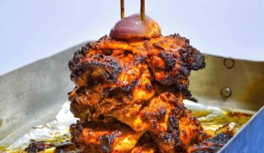 Oven roasted chicken shawarma served with hummus, radish, red onion pickles and tangy green herb sauce