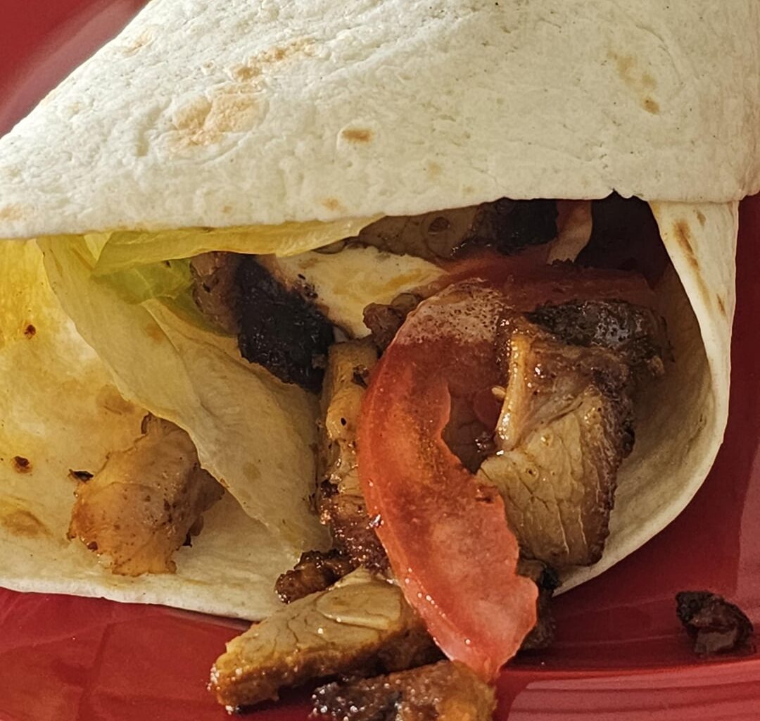 Wrapping leftover spare ribs, with some tomatoes and lettuce