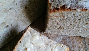 freshly baked sourdough bread, the first slice with butter&salt
