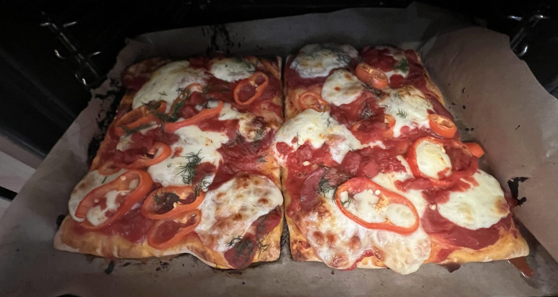 Two square pizzas in the oven
