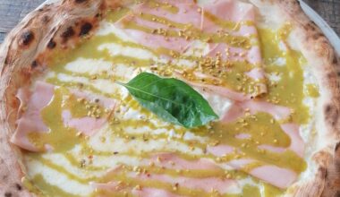 White sauce pizza with pistachio