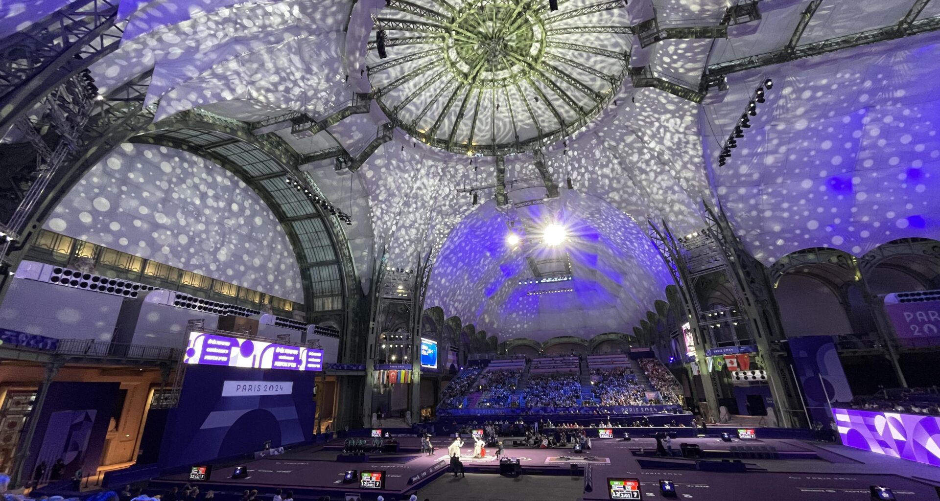 Another view of wheelchair fencing in Grand Palais, Paris