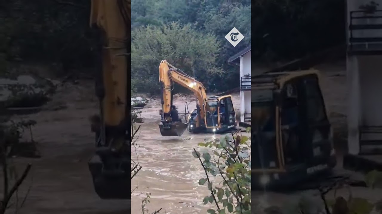 Couple trapped in flooded house rescued with digger