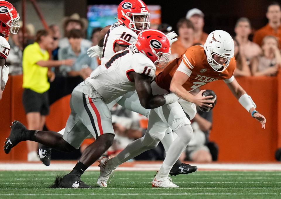 Georgia Bulldogs linebacker Jalon Walker sacks Texas Longhorns quarterback Quinn Ewers in the second quarter at Darrell K Royal-Texas Memorial Stadium Saturday October 19, 2024.