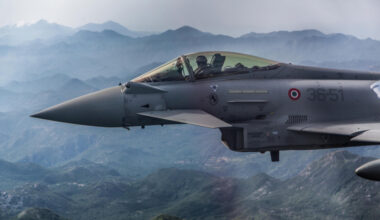 An Italian Eurofighter flies next to a Montenegrin Learjet 45 during a simulated interception exercise over Montenegro, part of the NATO Air Policing mission in the country.