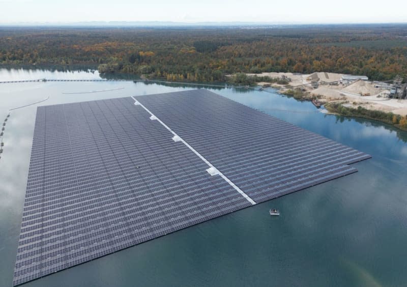 A view of the largest floating photovoltaic system in Germany, on the Philippsee. The more than 27,000 solar modules with a maximum output of 15 megawatts have been installed over more than eight hectares on the Philippsee, an artificial lake created from a gravel pit, and was inaugurated in Bad Schoenborn north-west of Stuttgart on Monday. Bernd Weißbrod/dpa