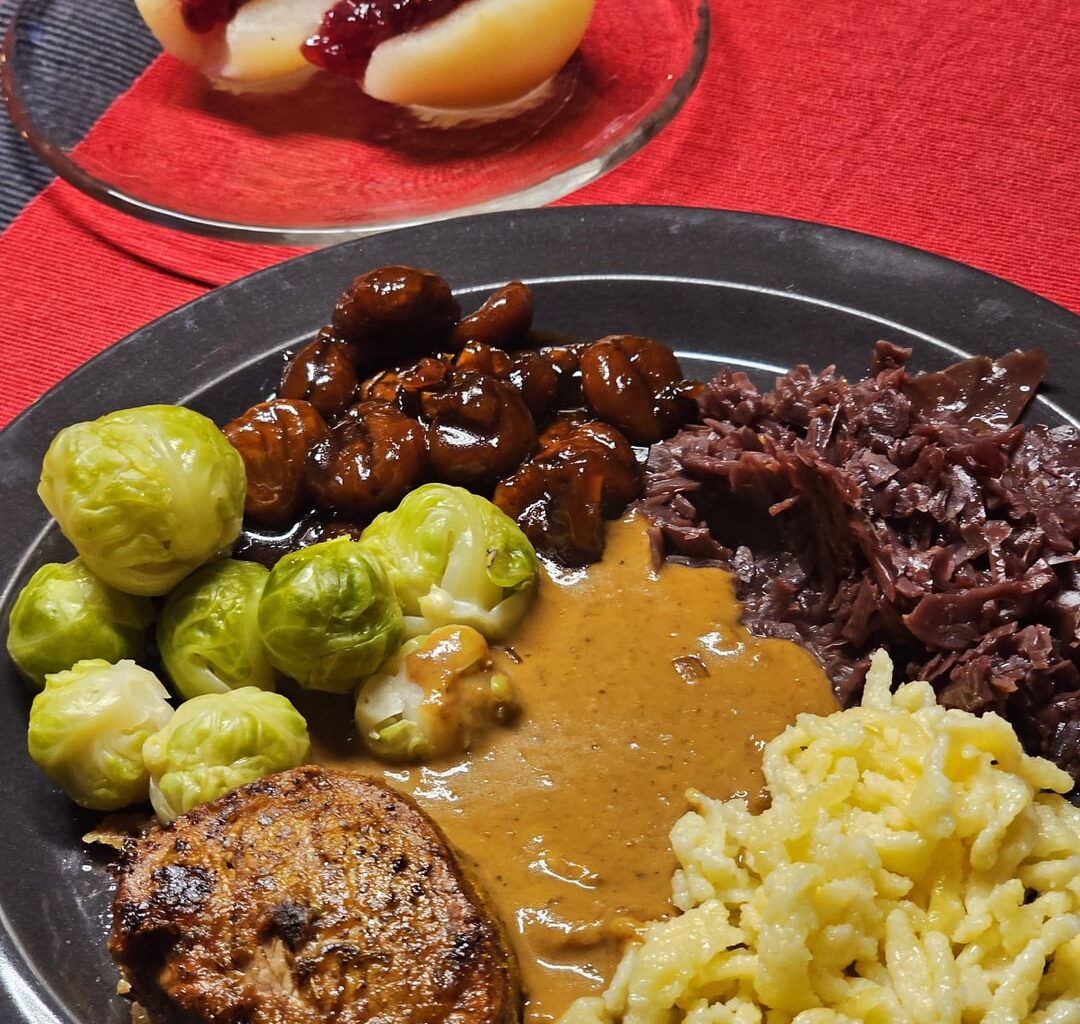 Autumn menu: Pork fillet medallions cooked in the oven at a low temperature, served in a creamy white wine sauce with chopped dried porcini mushrooms, along with homemade Spätzle, preserved red cabbage from last year, fresh Brussels sprouts, caramelised chestnuts and half pears with cranberries