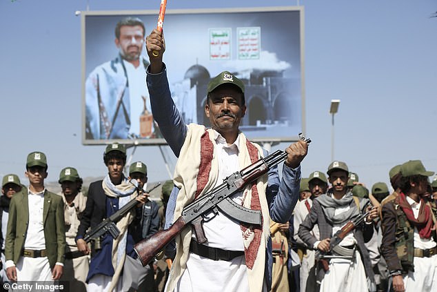 Yemen's Houthi movement supporters march in a parade in Sana'a on September 21, 2024