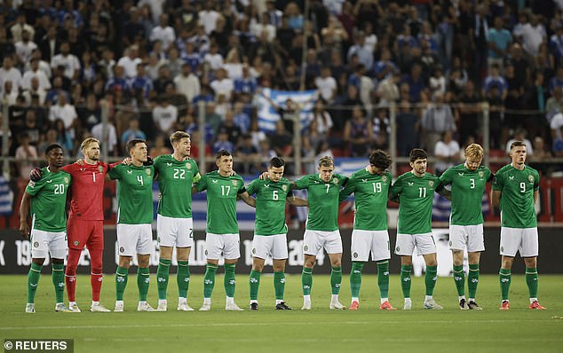 Ireland's players pictured during a minute's silence before their match in Piraeus