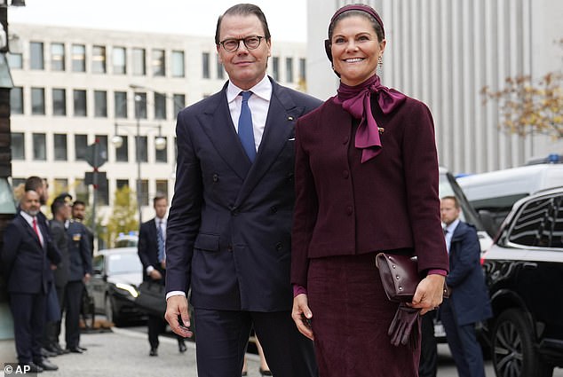 Victoria opted for a burgundy skirt suit, which she paired with a silk blouse in the same shade with a pussybow detail