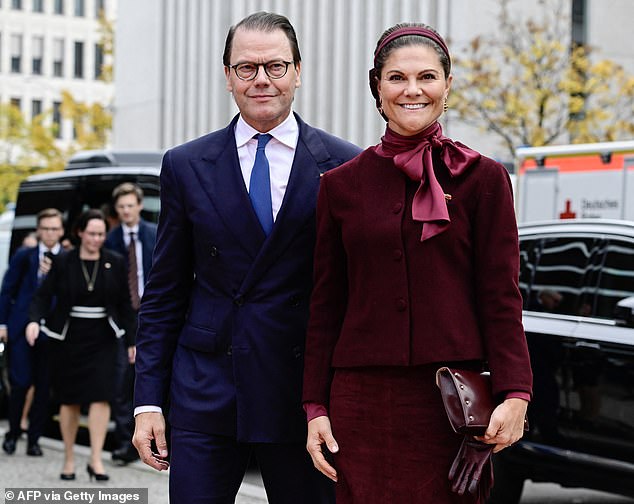 Victoria, Crown Princess of Sweden (pictured), looked typically chic in the colour of the season today as she attended a 25th anniversary celebration in Berlin, Germany
