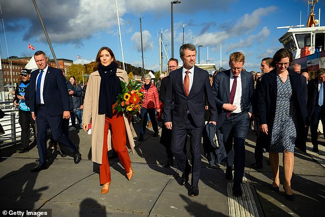 The Danish royals were out in Kiel on a sunny October day. They are pictured walking along the quay to the Reventlow Brake ferry pier