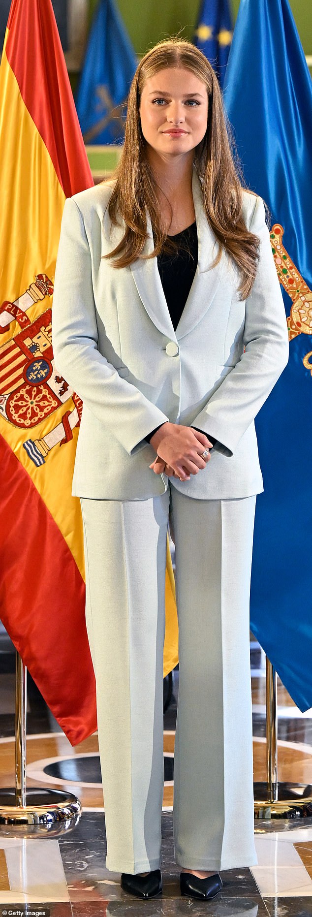 The 18-year-old royal cut a smart figure in a light grey suit, layered with a chic black top underneath