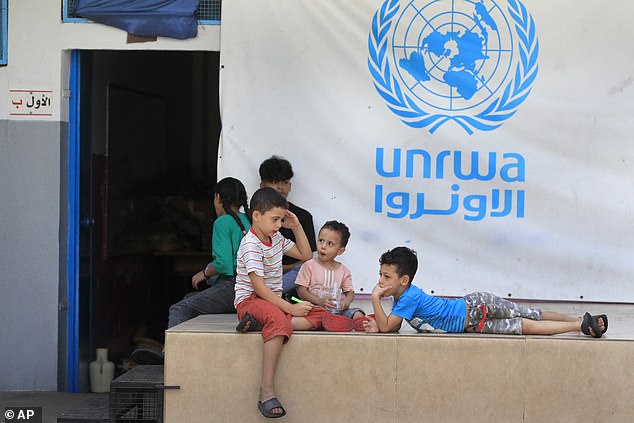 Palestinian children in a UNRWA school. A UN investigation insisted that nine employees from the agency, which employs 13,000, 'may have' been involved in the October 7 attack last year