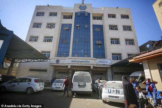 Palestinians outside a UN clinic in Deir al-Balah. UK ministers warned the move to block the agency risked 'jeopardising the international humanitarian response in Gaza'