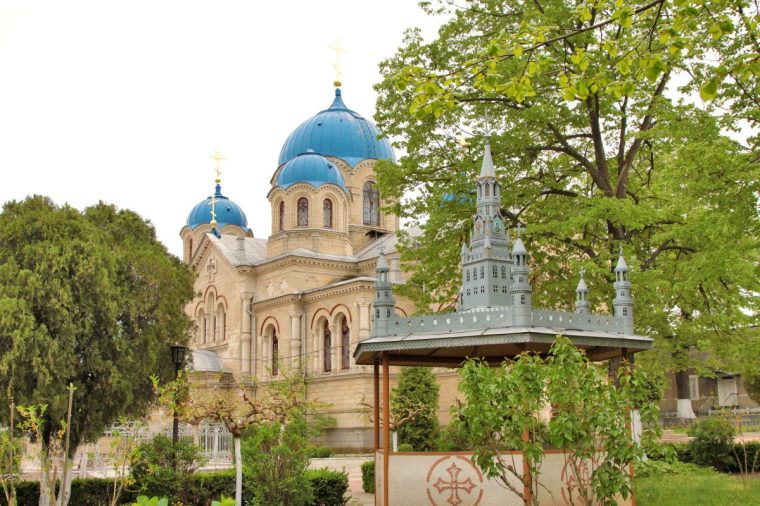Transnistria / Moldova - Kitskany - The assumption church of holy ascension kitskansky monastery along with a chapel with an unusual roof of carved metal monastic buildings