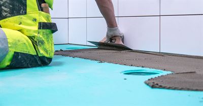 Bathrooms in Finland often hide a turquoise secret – celebrating 25 years of this waterproofing innovation