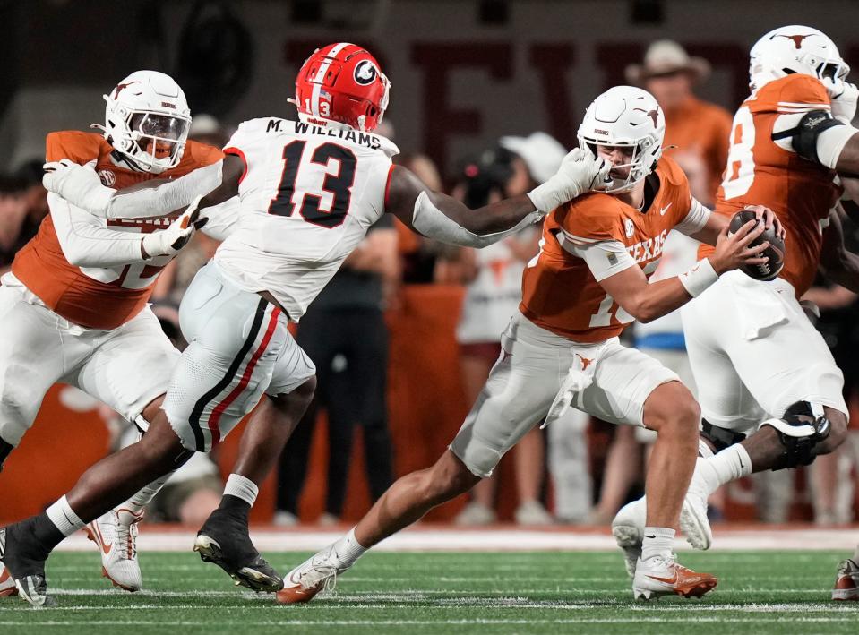 Oct 19, 2024; Austin, Texas, USA; Georgia Bulldogs defensive lineman Mykel Williams face masks Texas Longhorns quarterback Arch Manning in the second quarter at Darrell K. Royal Texas Memorial Stadium. Mandatory Credit: Jay Janner/USA TODAY Network via Imagn Images