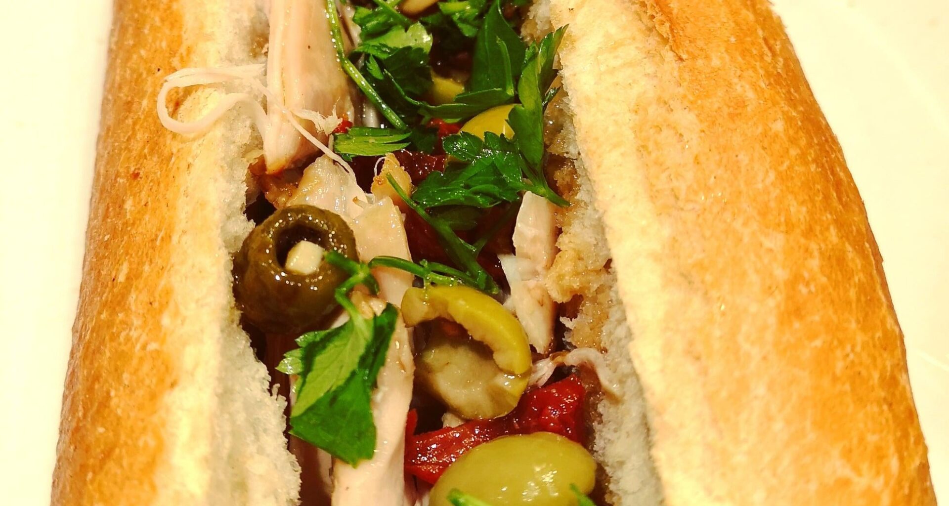 Chicken Marbella baguette