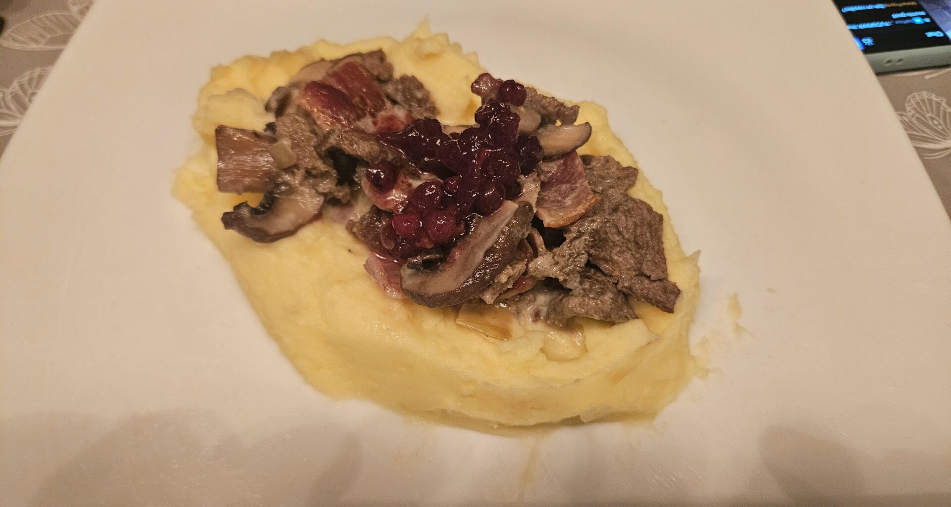 Finnbiff - reindeer in a bacon + mushroom cream sauce, served with mashed potatoes and lingonberry jam