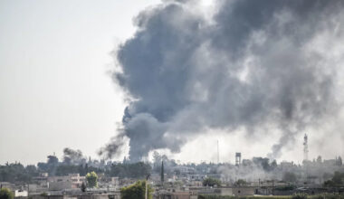 Smoke billows from a fire inside Syria during bombardment by Turkish forces