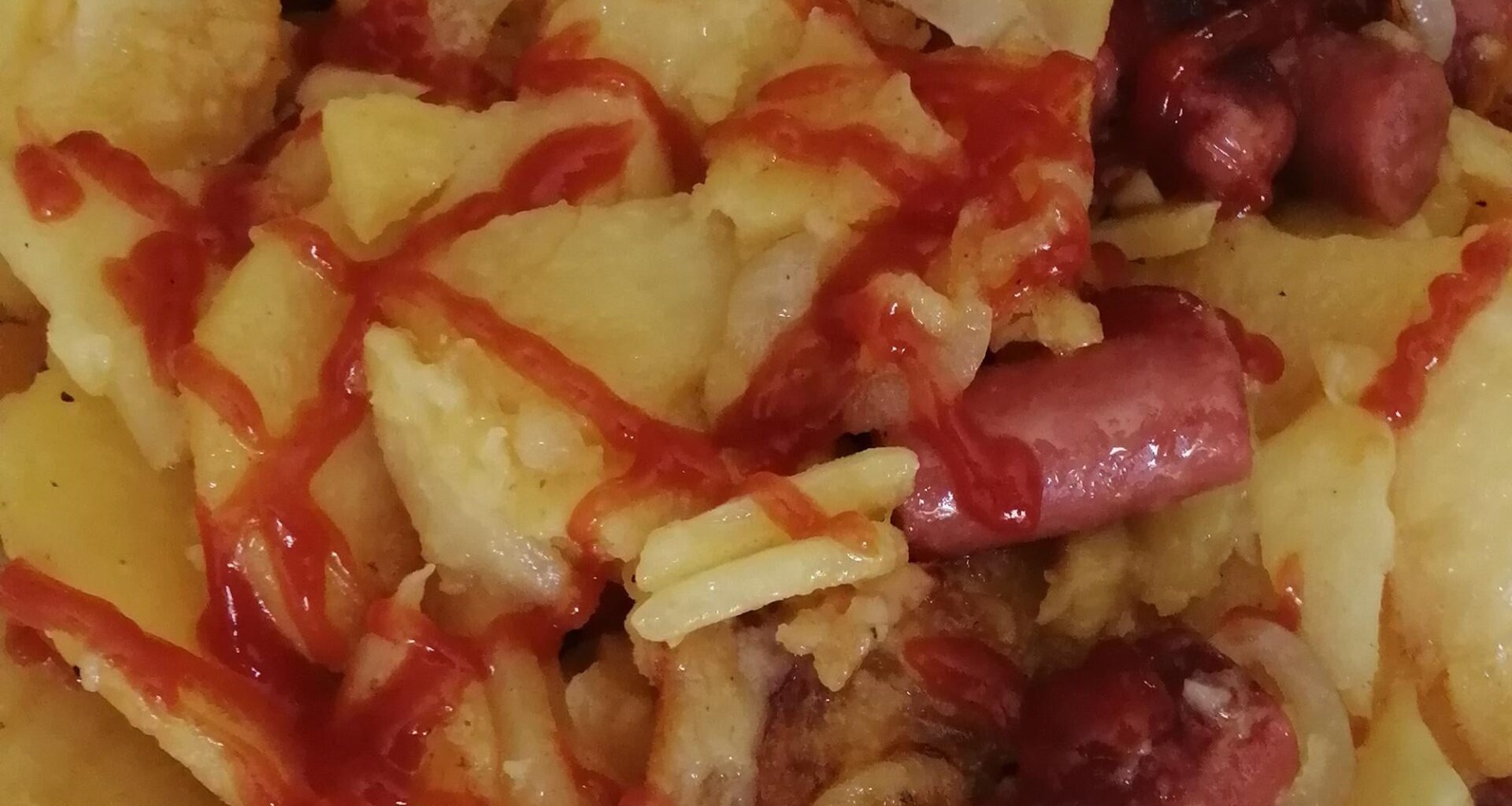 Fried Sliced Potatoes and Hotdog Sausages