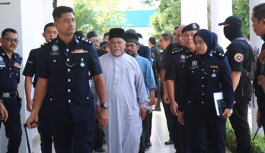 Malaysia charges 22 members of an Islamic business group, including its CEO, for organized crime