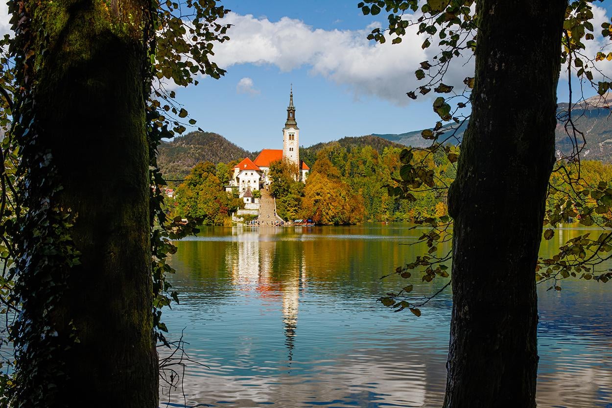 Bled Island view in autumn. A walk around Lake Bled in Slovenia.