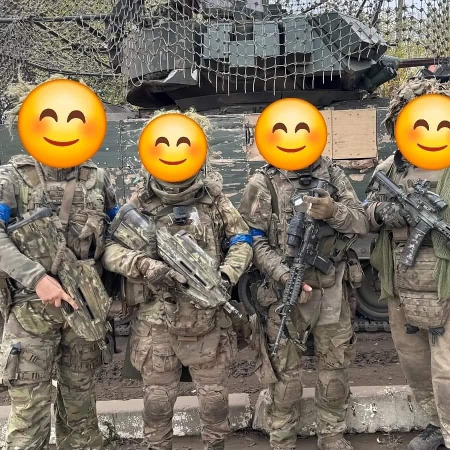 Ukrainian Army soldiers with FN F2000 and Colt M4A1 assault rifles, and an M2 Bradley infantry fighting vehicle (IFV) - in the Kursk Oblast.