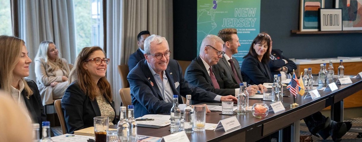 Photo: Governor Murphy sitting with other people at the table