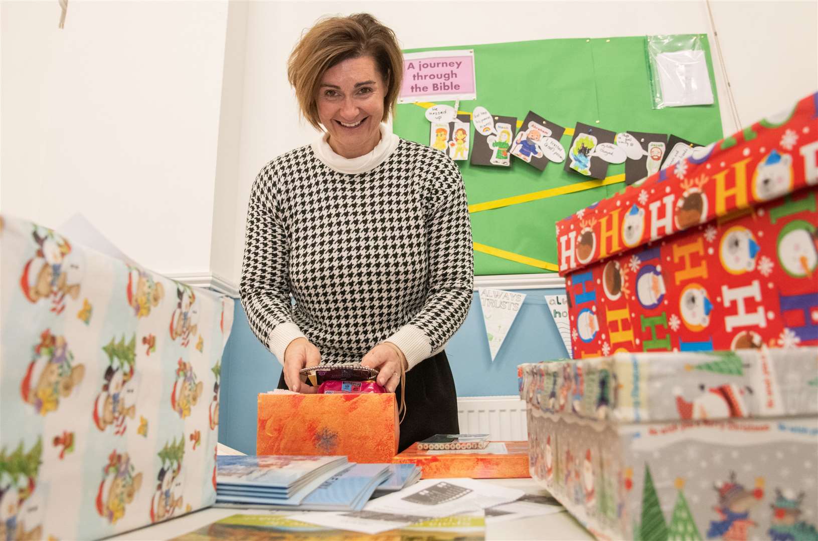 Deborah Miller fills a festive shoebox. Picture: Daniel Forsyth
