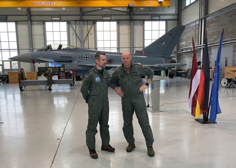 German Contingent Commander Lieutenant Colonel Christian Blohm (L) and Inspector of the German Air Force Ingo Gerhartz speak at the ceremony for the handover of the NATO Air Policing Mission. The Air Force is handing over responsibility for monitoring the airspace over Estonia, Latvia and Lithuania to the Netherlands. Alexander Welscher/dpa
