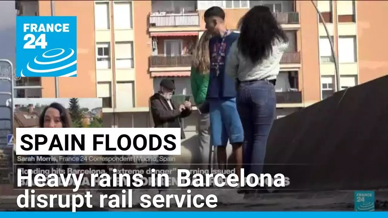 Heavy rains in Barcelona disrupt rail service as troops search for more flood victims in Valencia