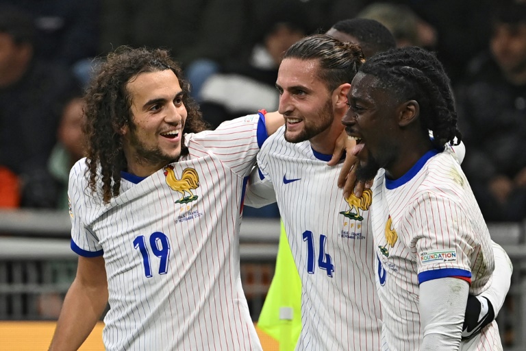 Adrien Rabiot (C) netted twice for France against Italy on Sunday (Isabella BONOTTO)