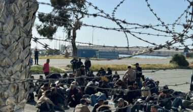 cover Police continue migrant returns