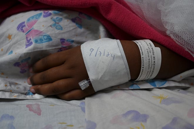 A child with dengue fever rests at a hospital in Tegucigalpa, Honduras, on July 12, 2024. An outbreak of dengue fever in Central America has left a hundred dead this year, with Guatemala accounting for half of the deaths.