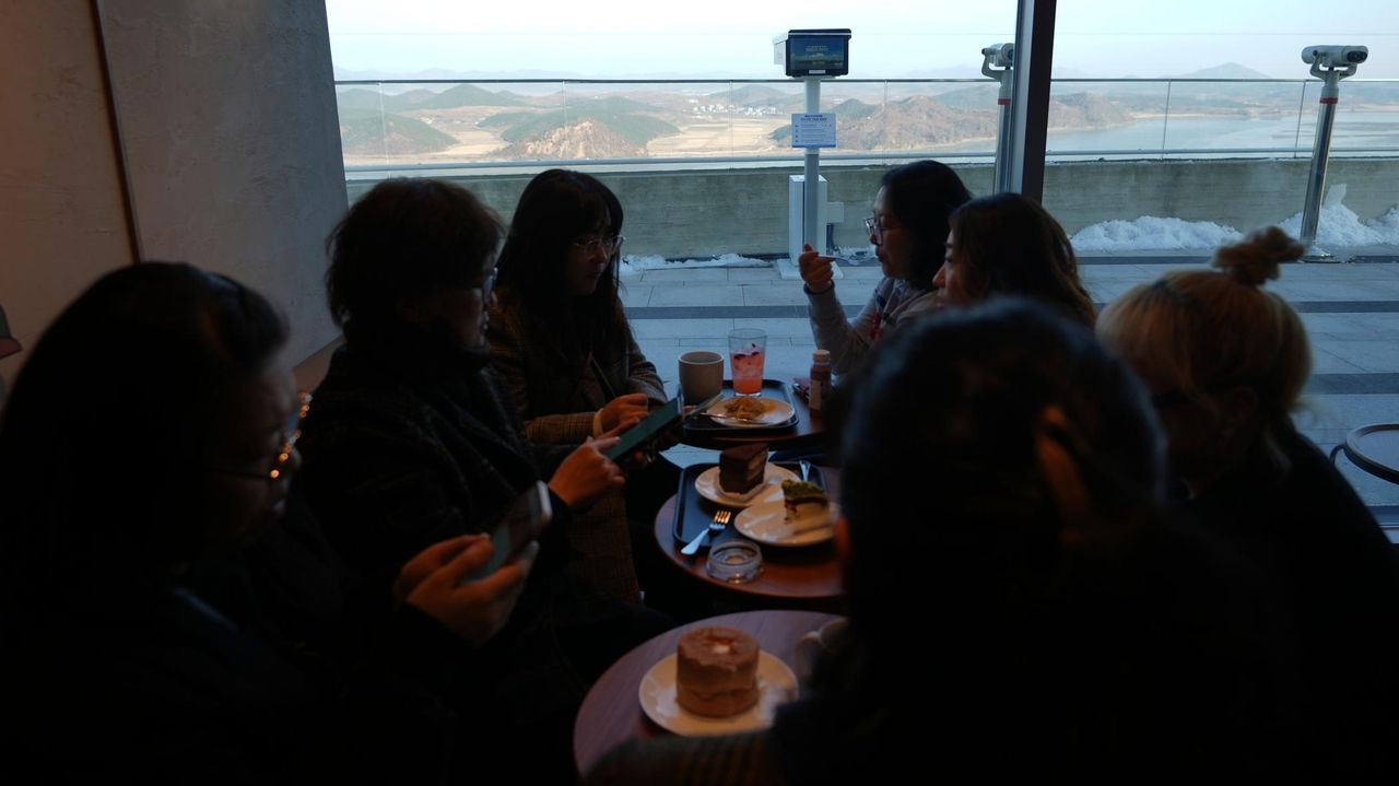 Customers at this Starbucks can sip coffee and observe a quiet North Korean mountain village