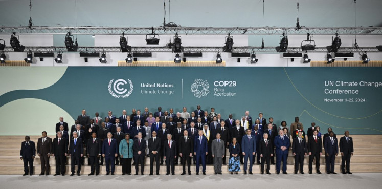 Participating world leaders and delegates pose for a family photo during the United Nations climate change conference (COP29) in Baku, Azerbaijan on Nov. 12, 2024.