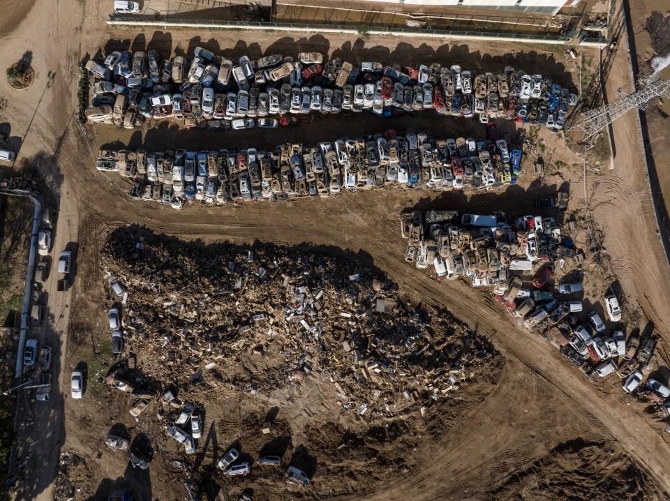 An aerial view of wrecked cars from the floods stored in a junkyard outside Paiporta